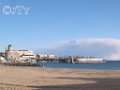 Le port et l esplanade Bonaparte vue de la plage de Frejus